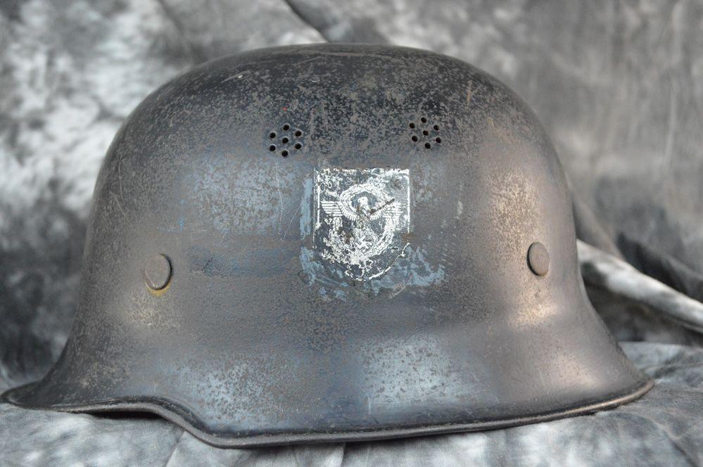 WWII German civilian police helmet eagle side view